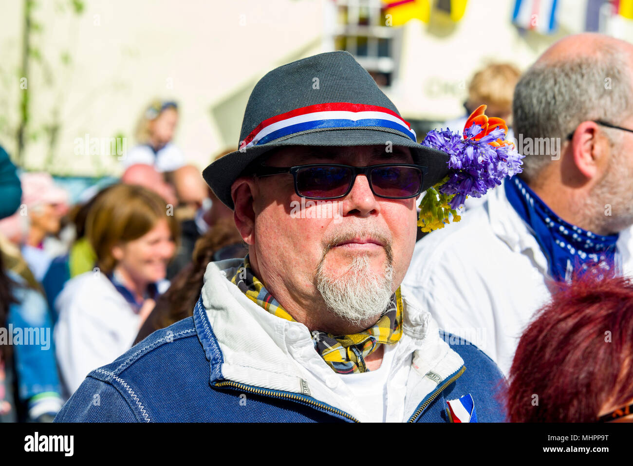 Editorial: Unknown members of the public, potential logos and signage. Padstow, Cornwall, UK 01/05/2018. Padstow residents parade through the streets  Stock Photo