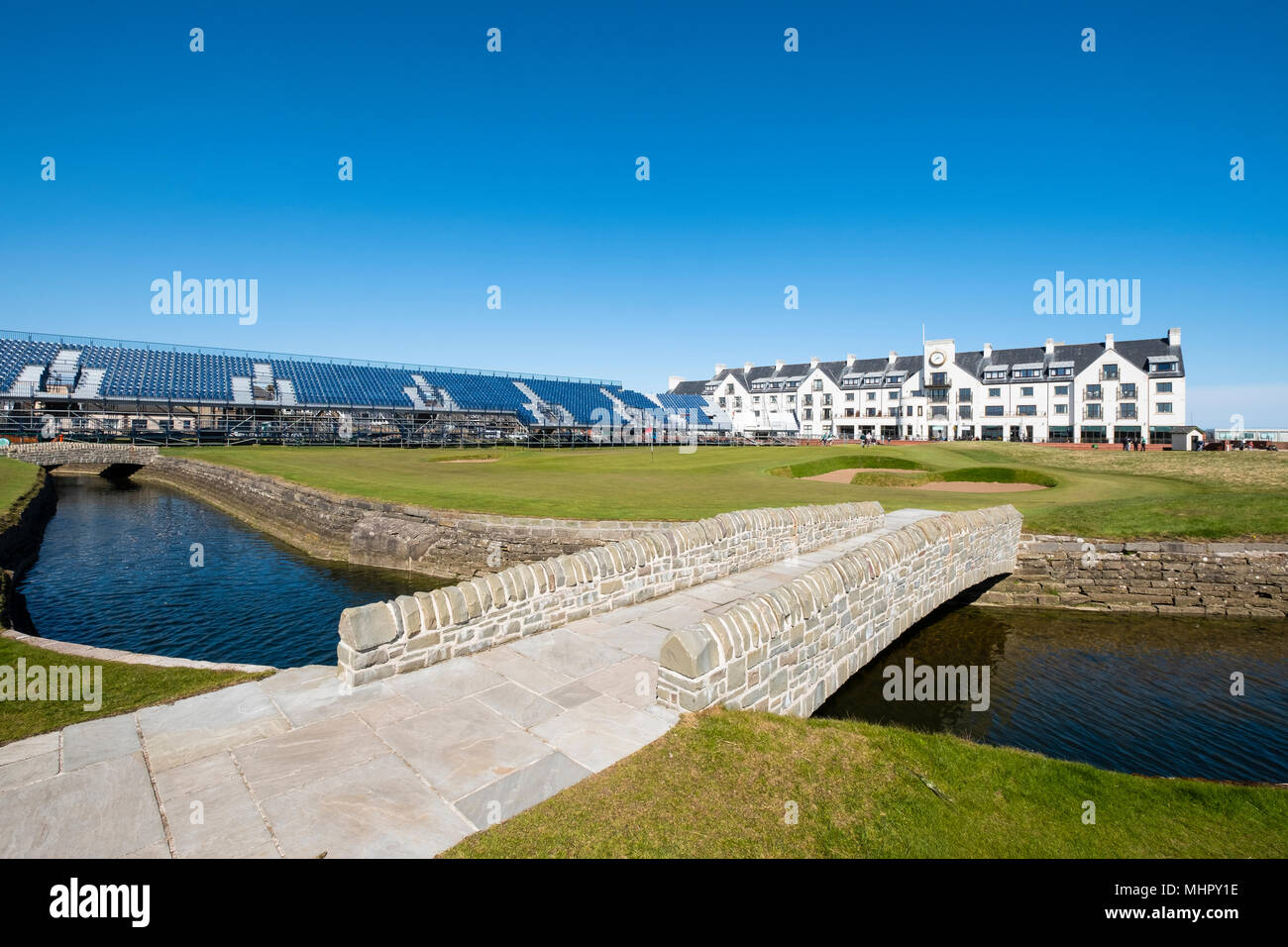 View of Carnoustie Golf Course Hotel behind 18th Green with Barry Burn and bridge  in foreground at Carnoustie Golf Links in Carnoustie, Angus, Scotla Stock Photo