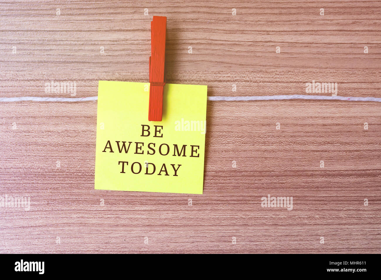 Inspirational quote - Be more awesome today on paper hanging by clothespins Stock Photo
