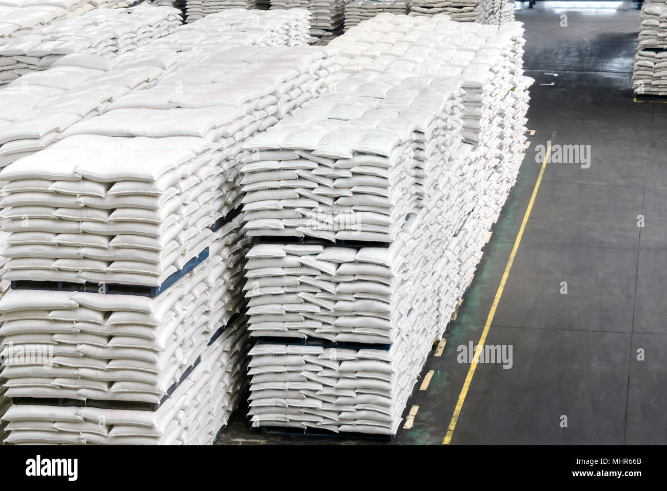 Animal feed bag food pallet system stacking in smart industry warehouse factory. Agricultural concept. Stock Photo