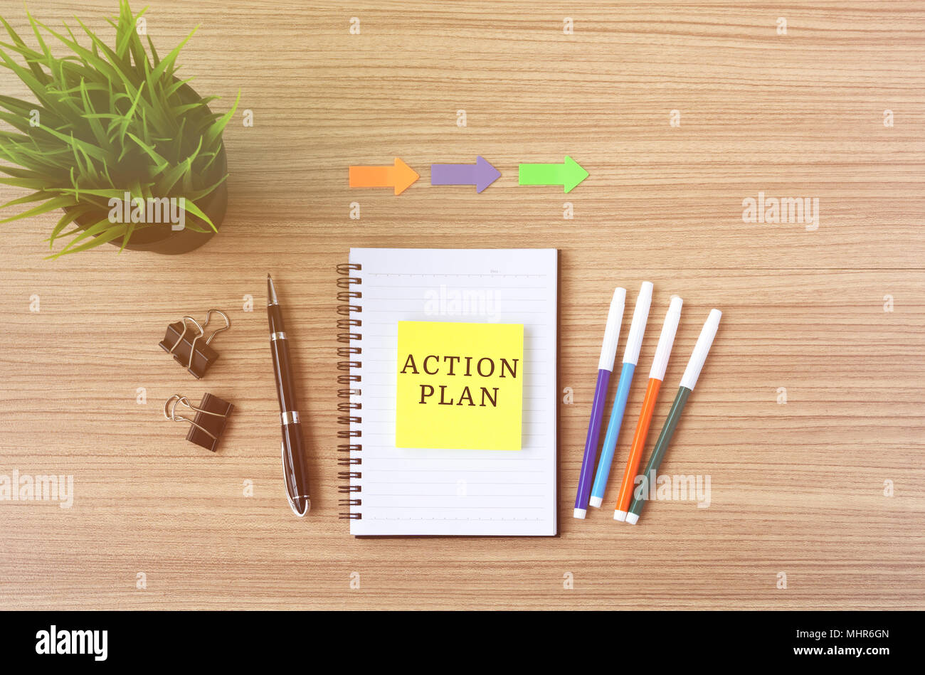 Action Plan text on sticky note, flat lay business office desk. Stock Photo