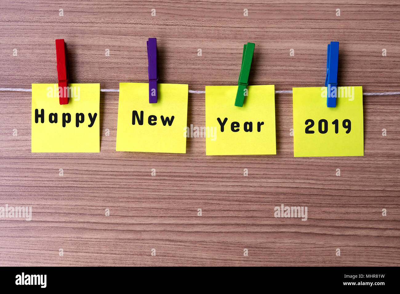 Happy New Year 2019 on notes hanging by clothespins Stock Photo