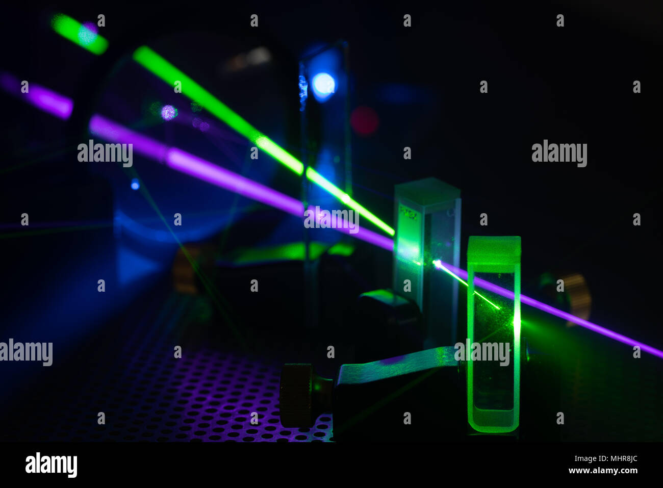 green and blue laser on optical table in physics laboratory Stock Photo
