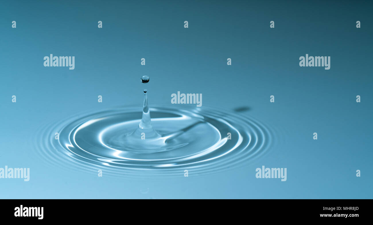 Falling water drop splash Stock Photo Alamy