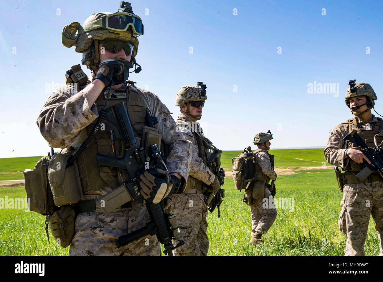 HAIFA, Israel (March 14, 2018) U.S. Marine Sgt. Jacob Bingham, left, a squad leader assigned to the Tactical Recovery of Aircraft Personnel (TRAP) team, 26th Marine Expeditionary Unit (MEU), communicates tactics through a hand-held radio during a simulated search mission, in Haifa, Israel, March 14, 2018. Juniper Cobra is a computer assisted exercise conducted through computer simulations focused on improving combined missile defense capabilities and overall interoperability between the U.S. European Command and Israel Defense Force. (U.S. Marine Corps Stock Photo