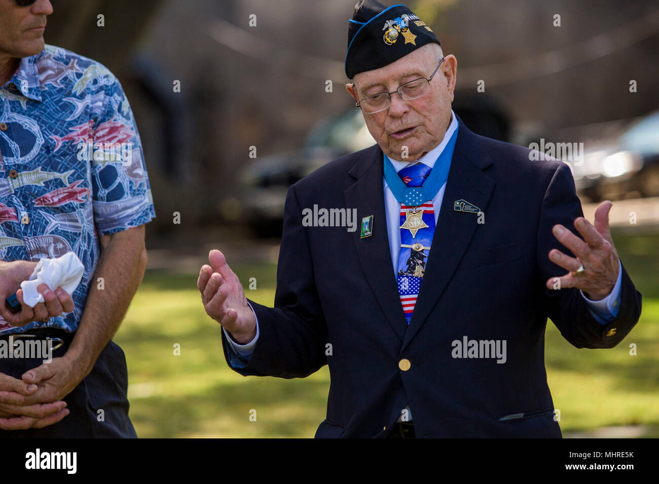 U.S. Marine Corps Chief Warrant Officer 4 Hershel 'Woody' Williams (Ret.) describes a portion of the war and what took place on Iwo Jima at the National Memorial Cemetary of the Pacific, Honolulu HI, March 17, 2018. Williams traveled to Oahu to participate in various events and visit the graves of World War II veterans that made the ultimate sacrifice. (U.S. Marine Corps Stock Photo