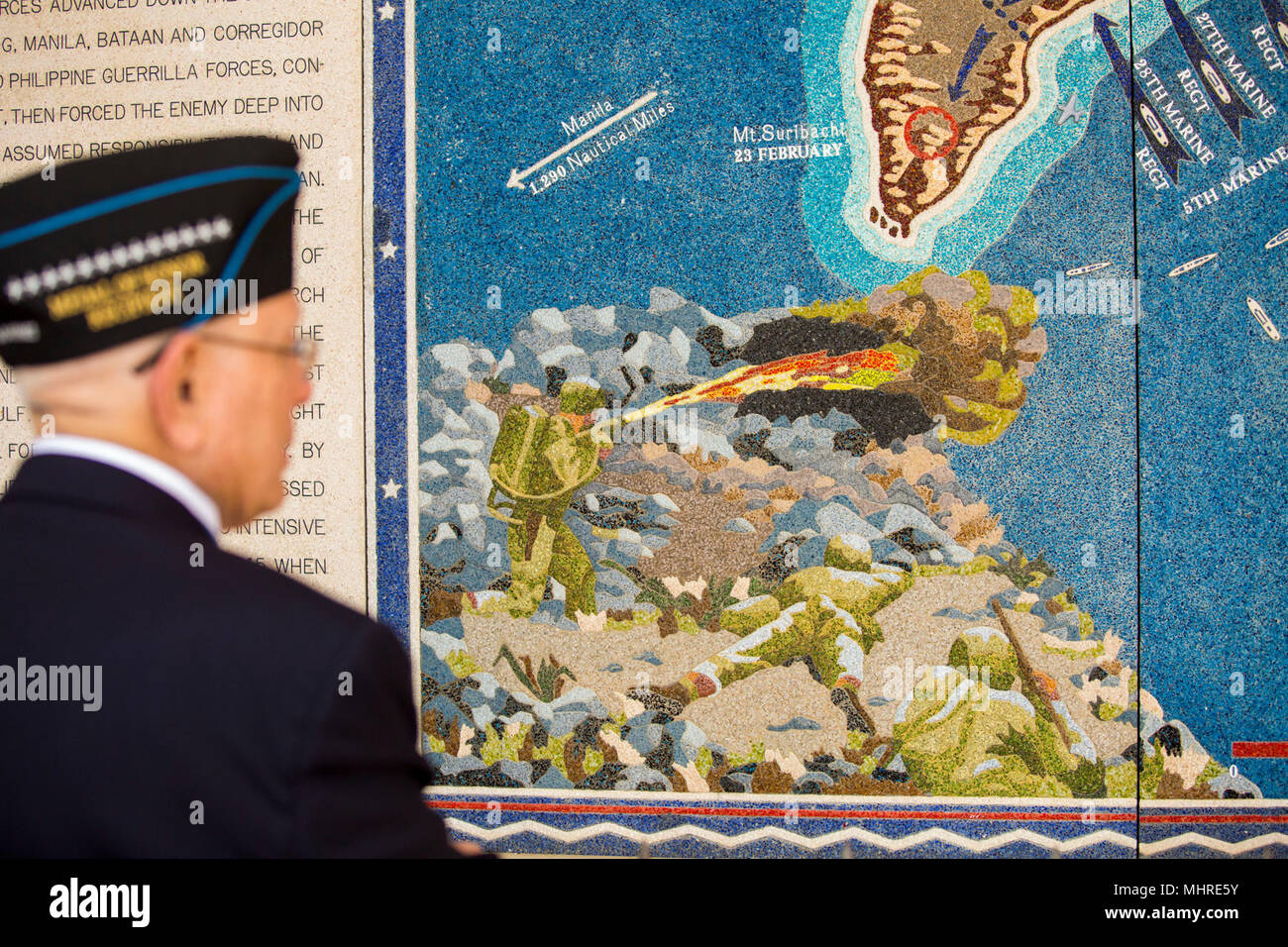U.S. Marine Corps Chief Warrant Officer 4 Hershel 'Woody' Williams (Ret.) observes a portion of a mosaic map of the Battle of Iwo Jima  which features a Marine using a flamethrower, National Memorial Cemetary of the Pacific, Honolulu HI, March 17, 2018. Williams traveled to Oahu to participate in various events and visit the graves of World War II veterans that made the ultimate sacrifice. (U.S. Marine Corps Stock Photo