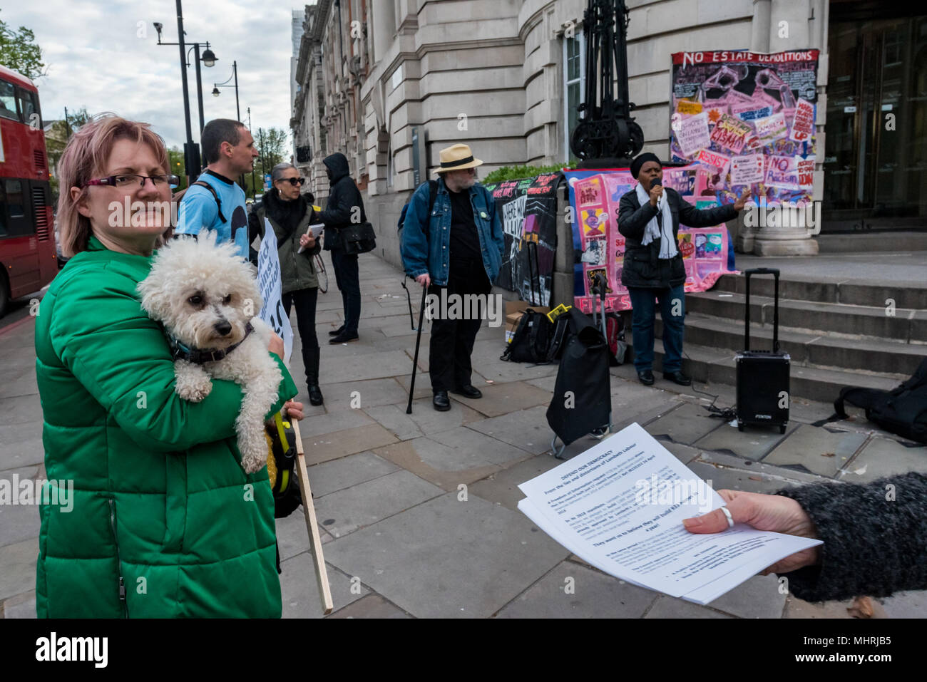 May 1, 2018 - London, UK. 1st May 2018. People hand out leaflets and listen to speeches at an emergency demonstration outside Lambeth Town Hall before Thursday's council elections calls for a public inquiry into Lambeth Labour's housing policy, an immediate halt to estate demolitions and a call to stop the privatisation via Homes for Lambeth which is leading to social cleansing. A Freedom of Information request by Brixton Buzz last month showed that the council built just 17 council homes with secure council tenancies between June 2014 and March 2018, despite claims in the current Lambeth La Stock Photo