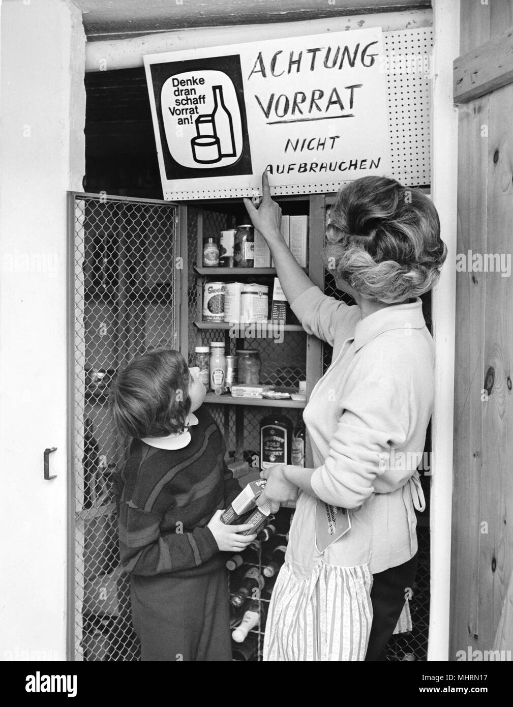 A Mother With Her Child Filling Up The Pantry Taken In February