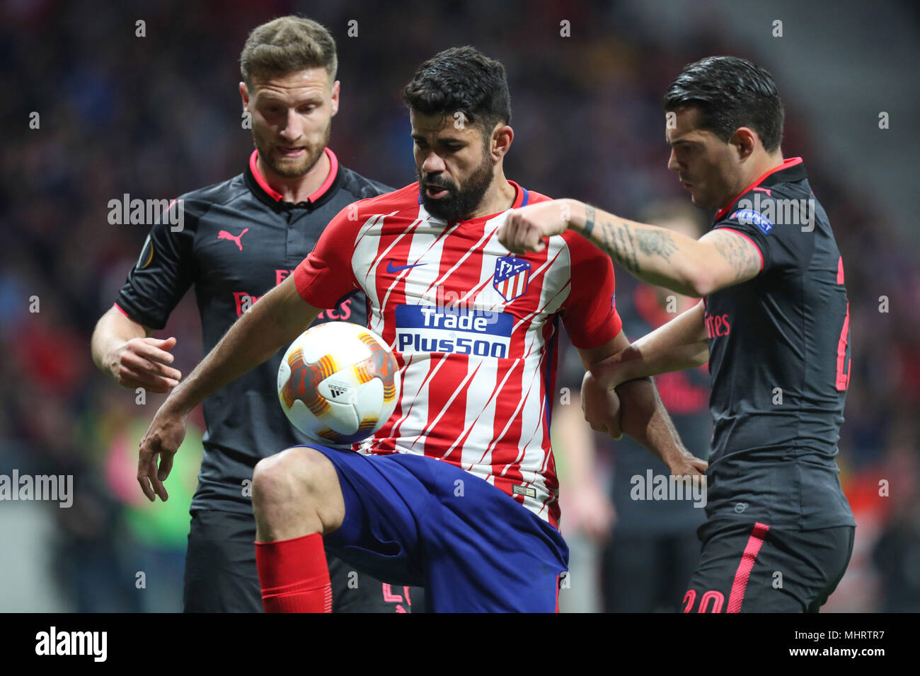 Madrid, Spain. 3rd May, 2018. DIEGO COSTA of Atletico de Madrid duels for the ball with GRANIT XHAKA of Arsenal FC during the UEFA Europa League, semi final, 2nd leg football match between Atletico de Madrid and Arsenal FC on May 3, 2018 at Metropolitano stadium in Madrid, Spain Credit: Manuel Blondeau/ZUMA Wire/Alamy Live News Stock Photo