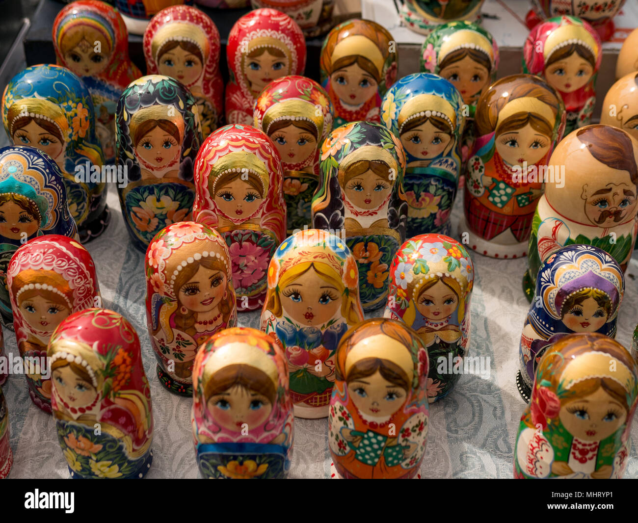 Matrioshka at the street market, iconic popular souvenir from Russia, Ukraine. Colorful bright russian nesting dolls. National traditions Consept Stock Photo