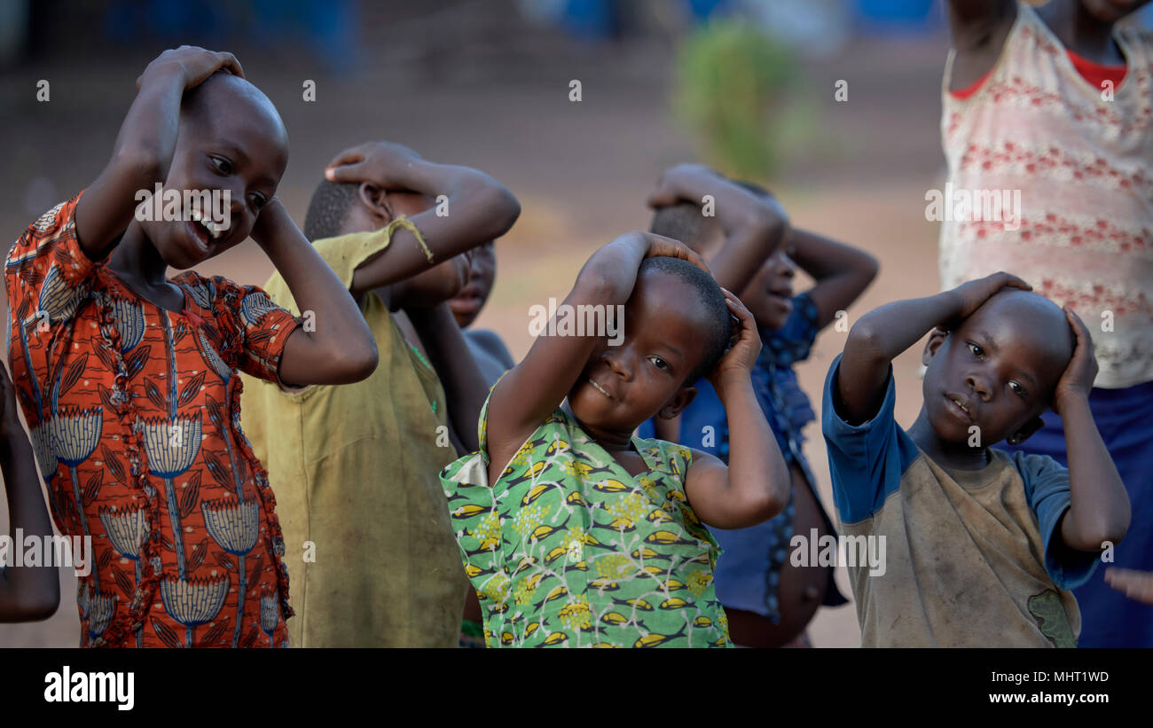 Children displaced by armed conflict at play in a camp for internally displaced persons in Riimenze, South Sudan. Stock Photo