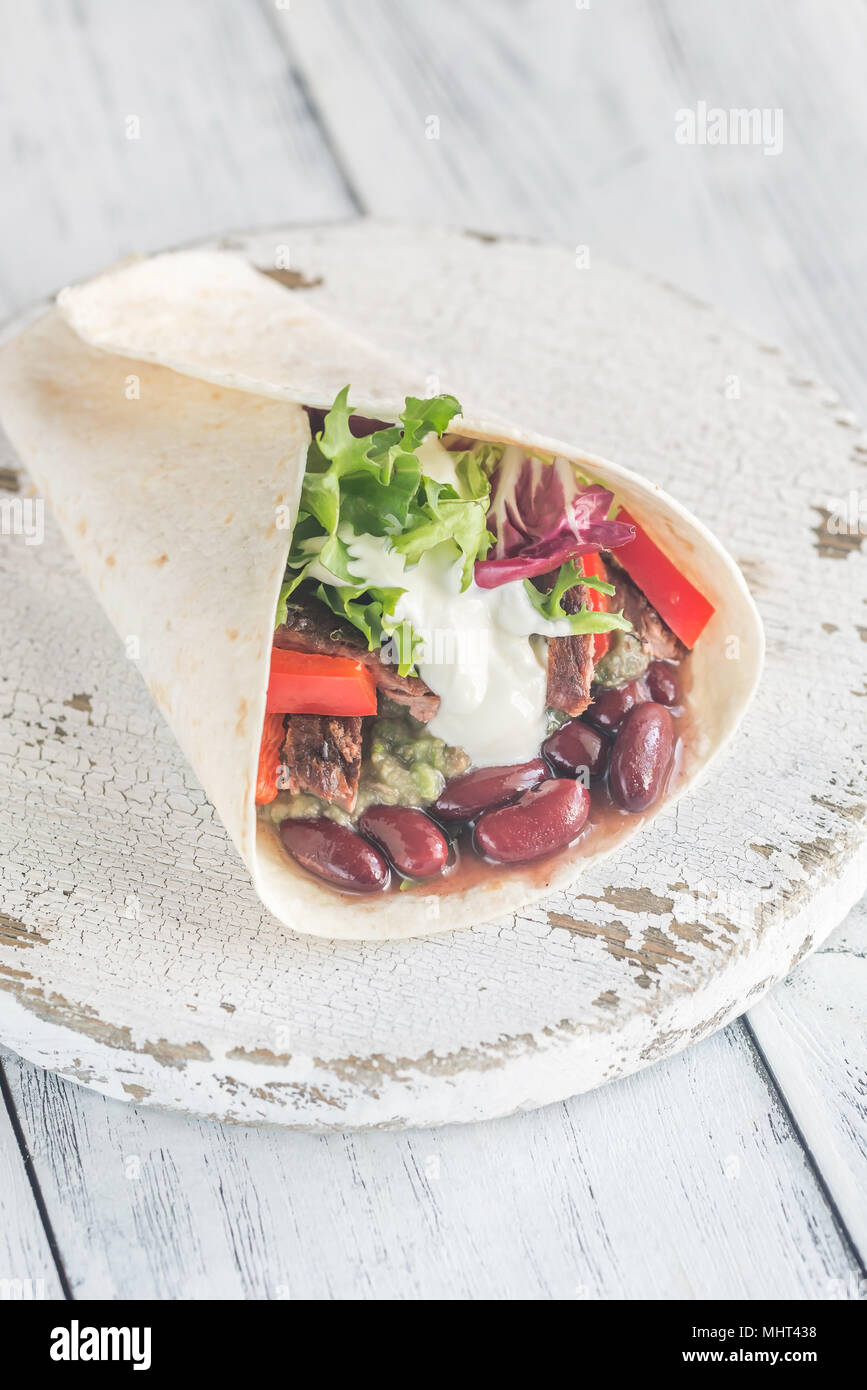 Burrito with meat and guacamole Stock Photo Alamy