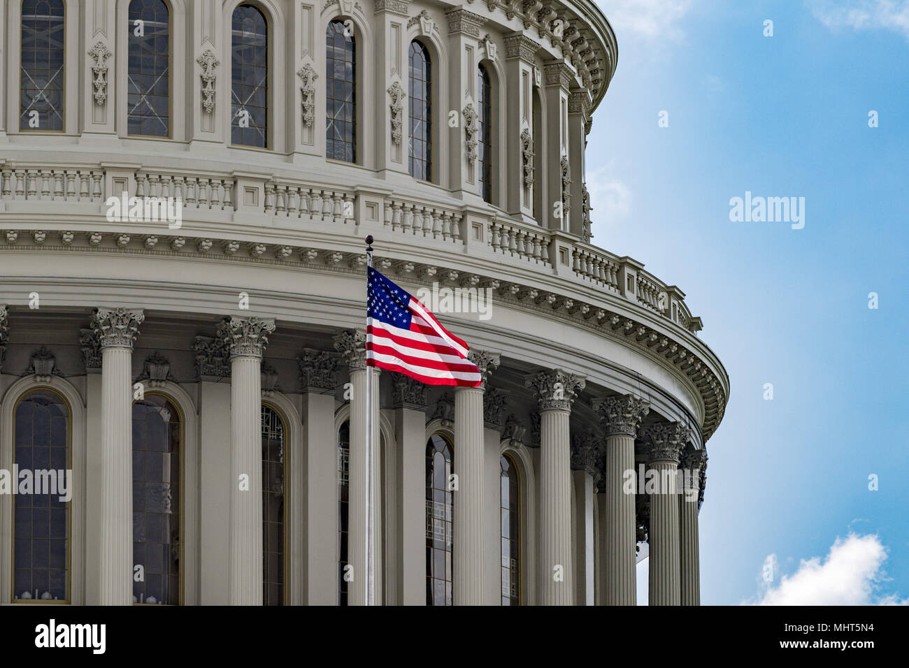 Washington DC Capitol dome detail with waving american flag Stock Photo ...