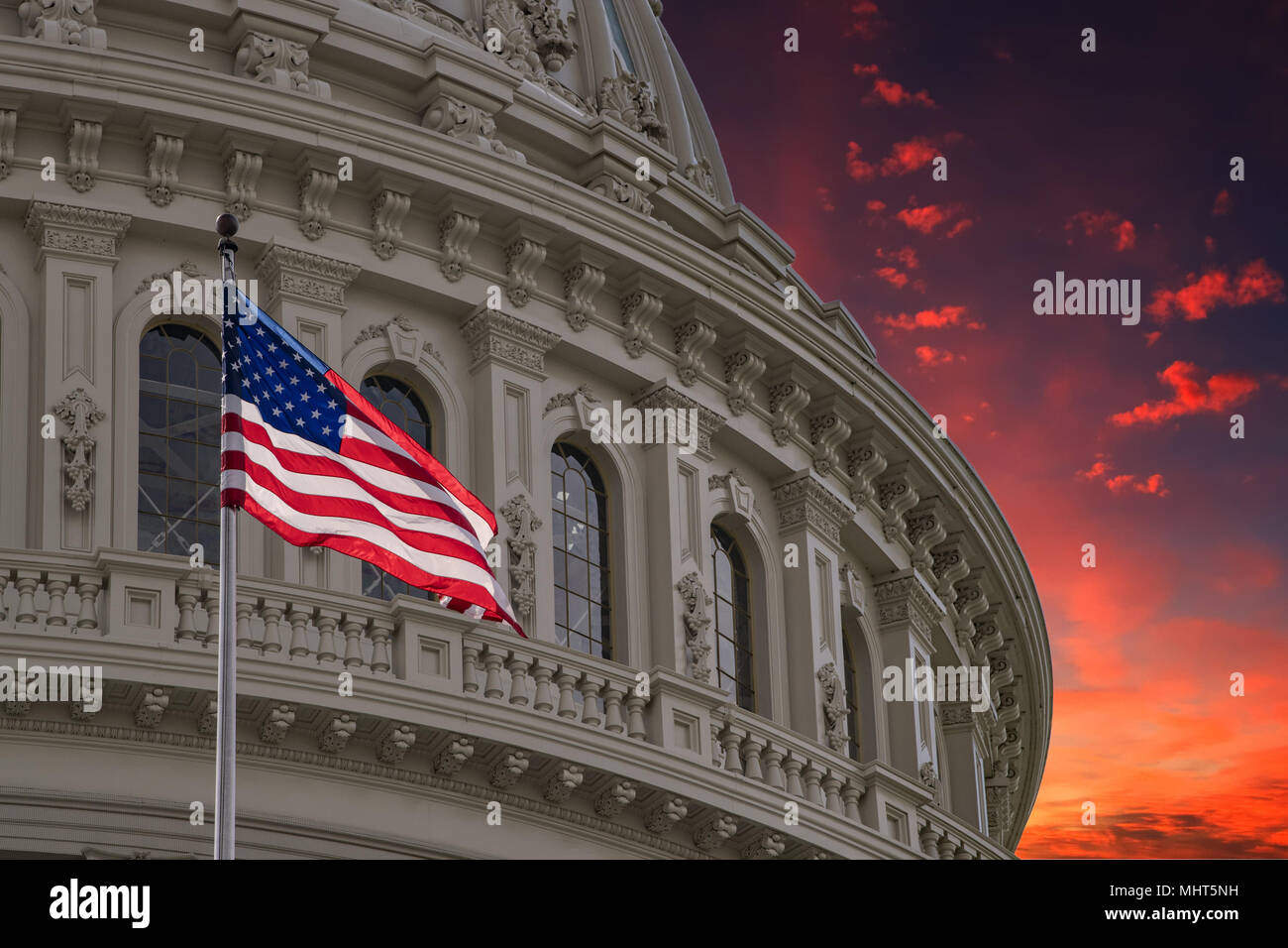 Washington DC Capitol dome detail with waving american flag Stock Photo ...