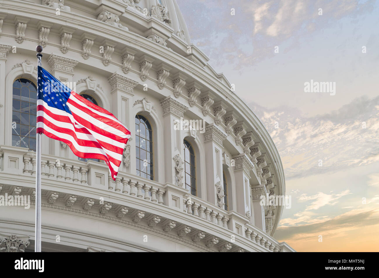 Washington DC Capitol dome detail with waving american flag Stock Photo ...