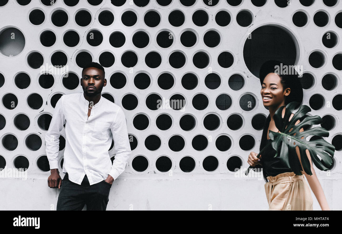 Stylish portrait of young Afro-American couple on white background. Stock Photo