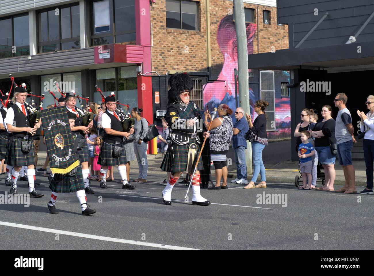 Pipes and drums band marching in ANZAC Day parade in Australia at Coffs