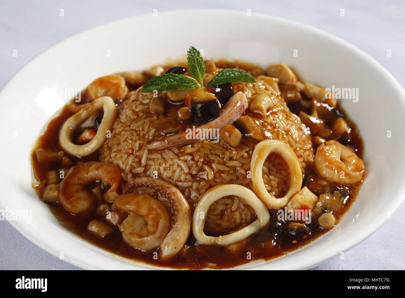 seafood abalone sauce over rice Stock Photo Alamy