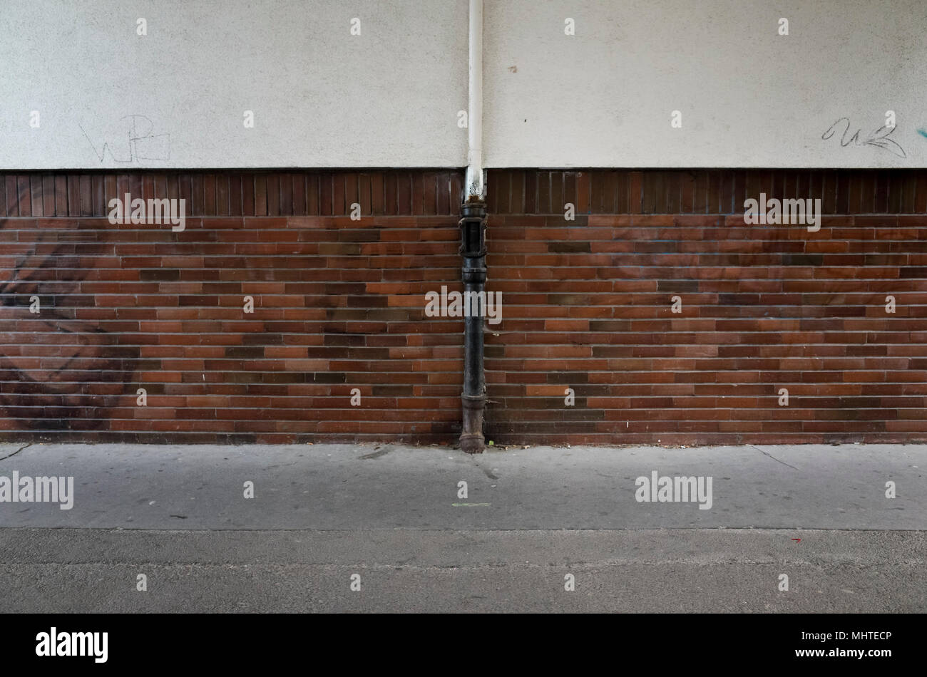 wall and water drainage pipe Stock Photo