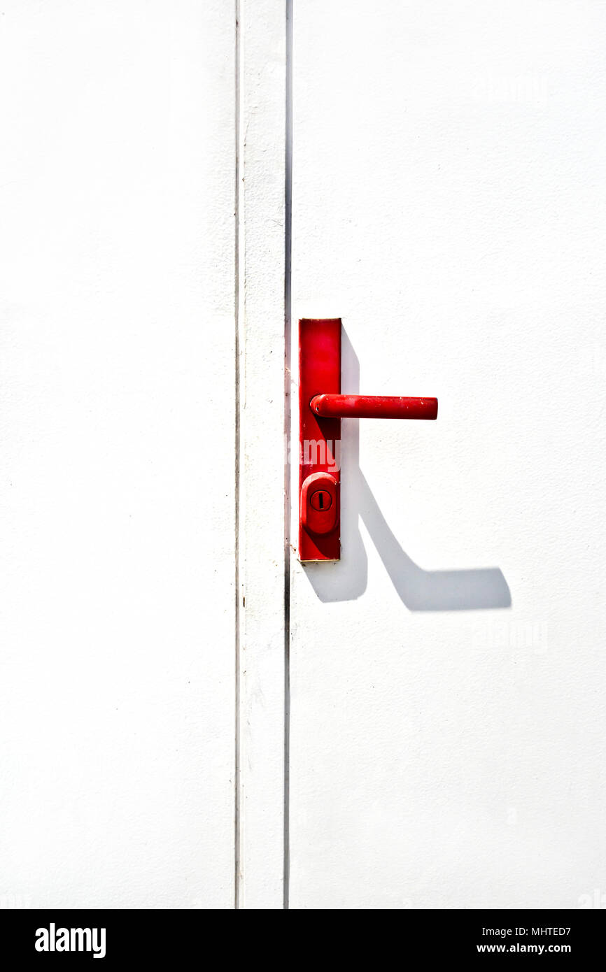 white door and red handle Stock Photo