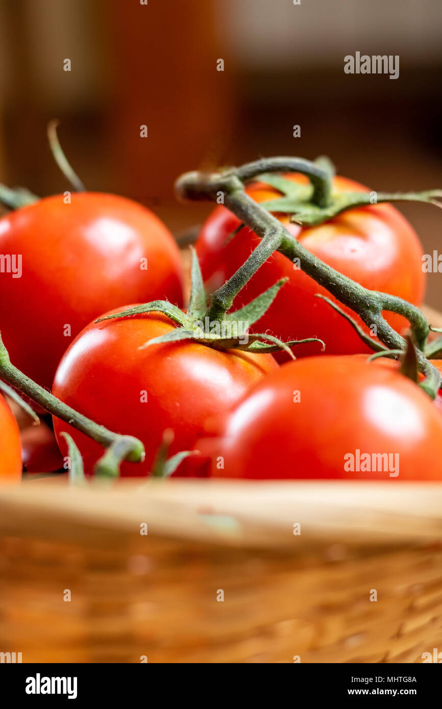 Tomatoes in a basket Stock Photo - Alamy