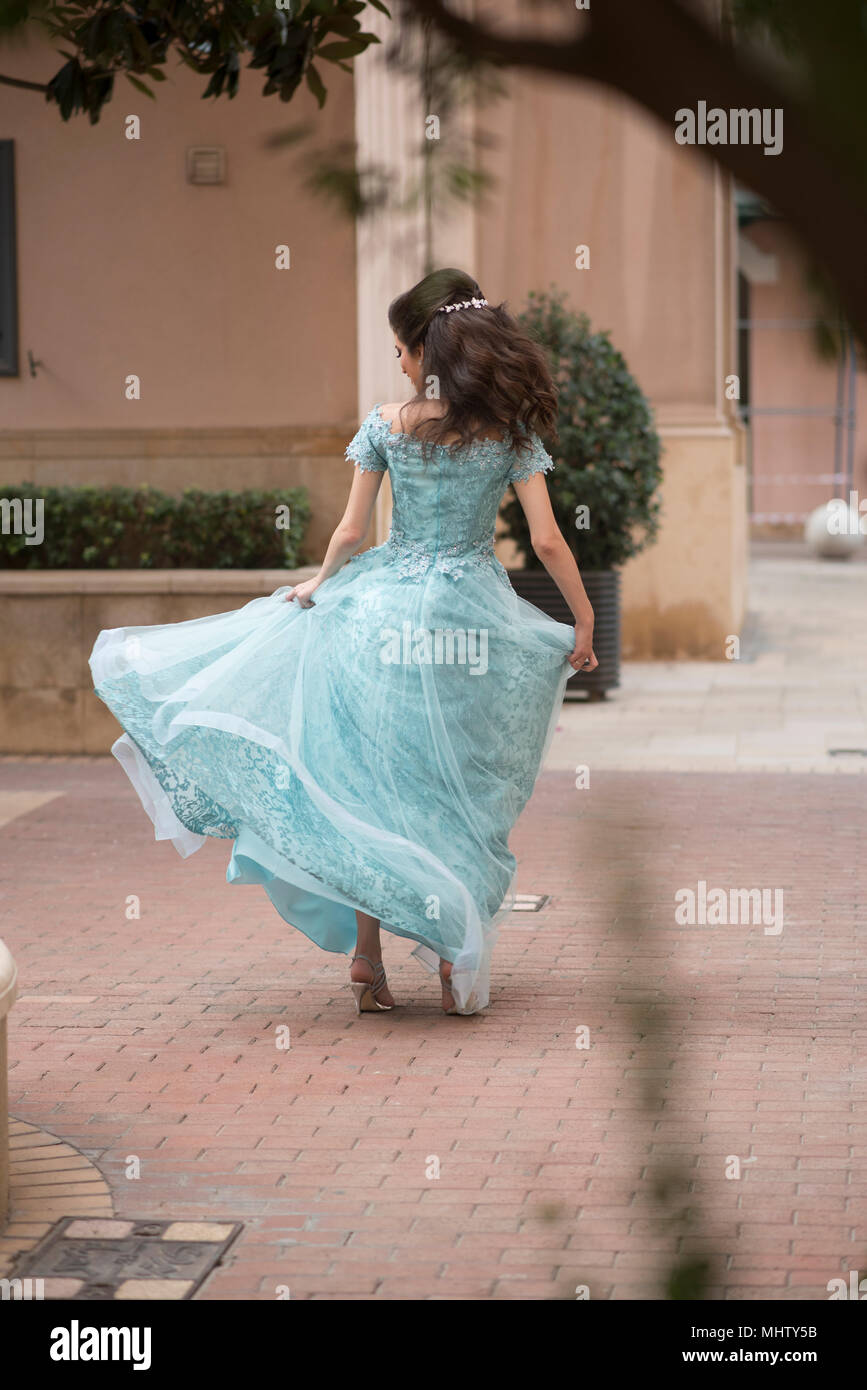 Full length of a woman twirling outdoors Stock Photo