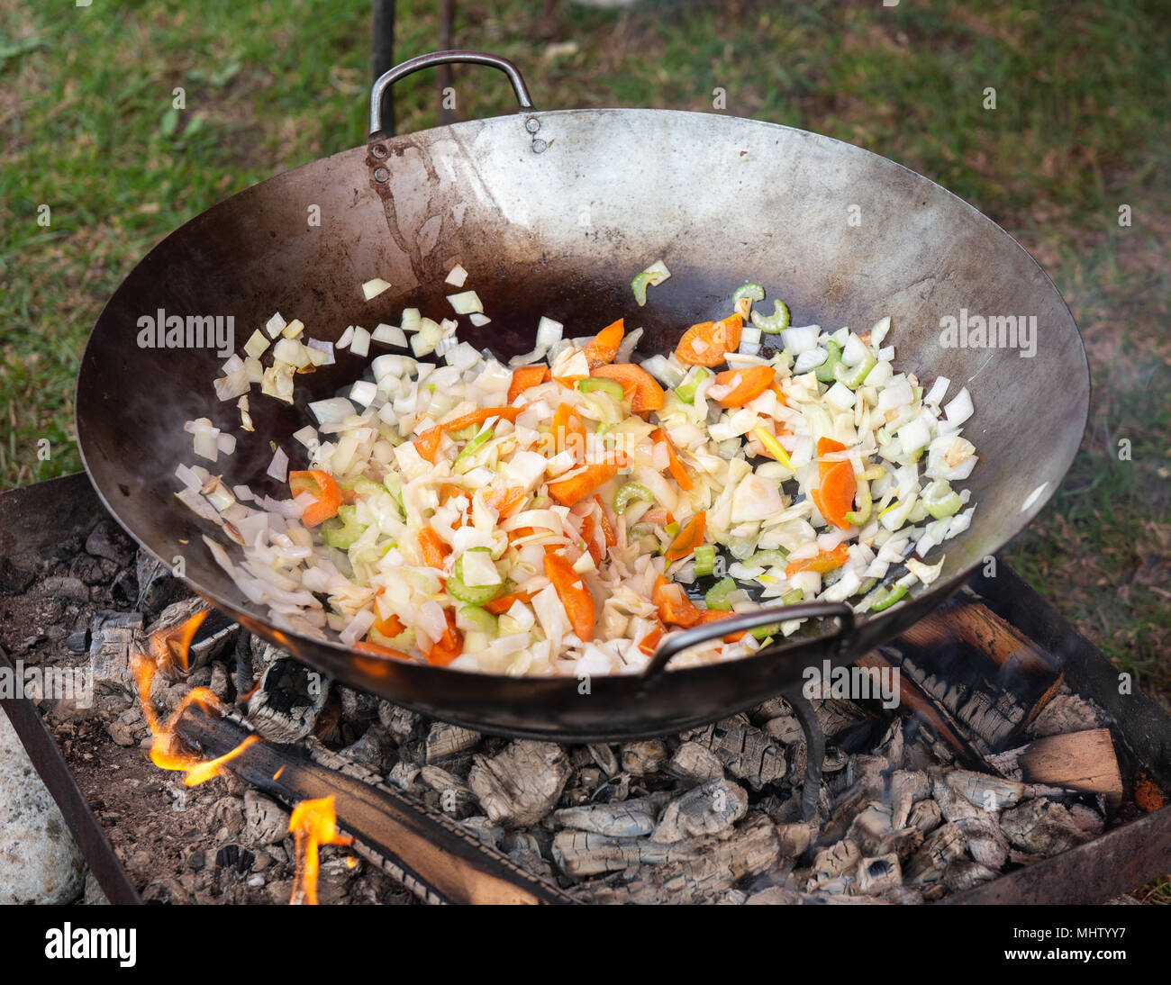 https://c8.alamy.com/comp/MHTYY7/cabbage-cole-carrot-and-other-vegetables-fry-in-a-large-metal-pot-on-an-burning-charcoal-in-the-open-air-preparation-of-food-in-a-medieval-kitchen-MHTYY7.jpg