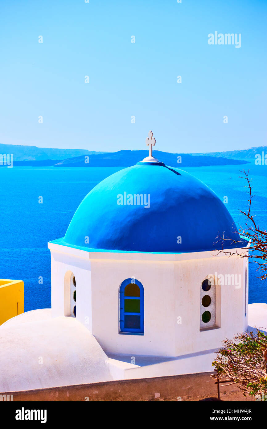Greek orthodox church with blue domes in Oia in Santorini island, Greece Stock Photo