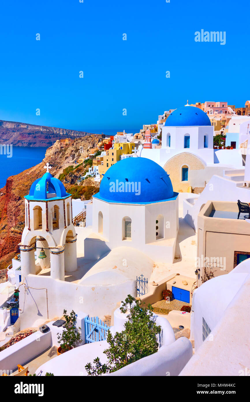 Greek church with blue domes in Oia in Santorini island, Greece Stock Photo