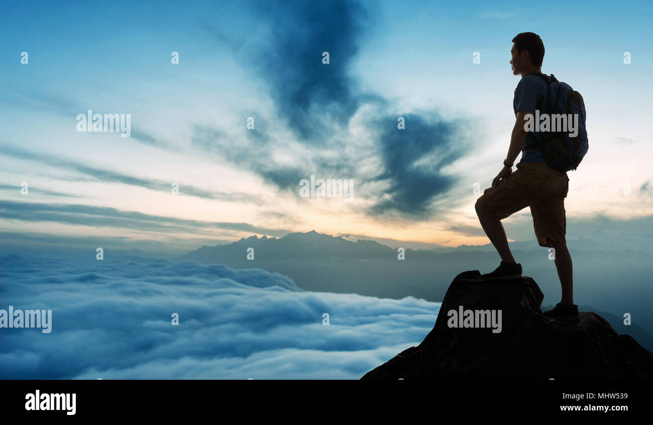 Middle Aged Man Standing On The Top Of The Mountain Stock Photo Alamy