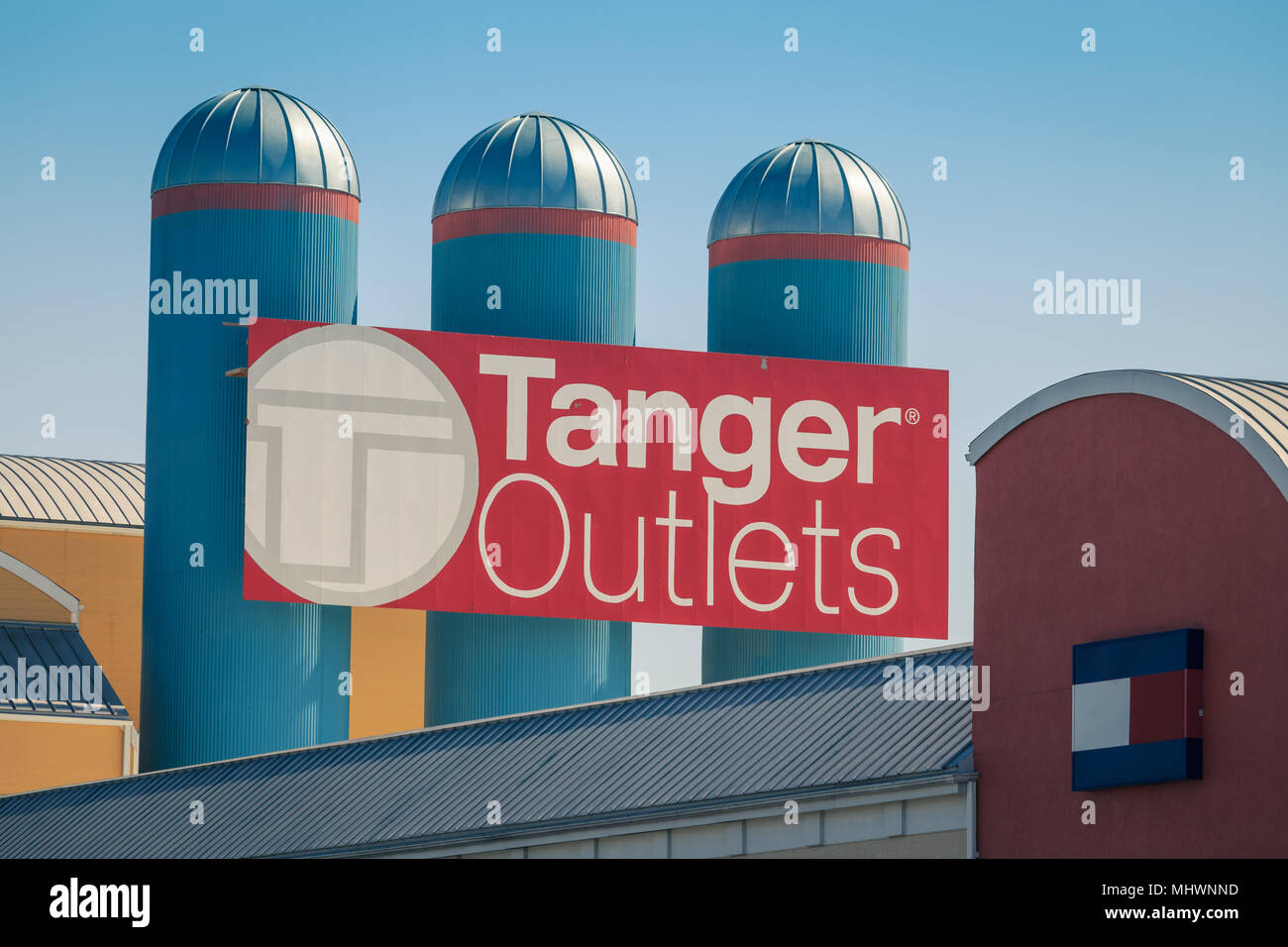 Lancaster, PA, USA - May 2, 2018: The Tanger Outlets sign on three silos. Tanger is a shopping-mall chain featuring brand-name and designer outlet sto Stock Photo