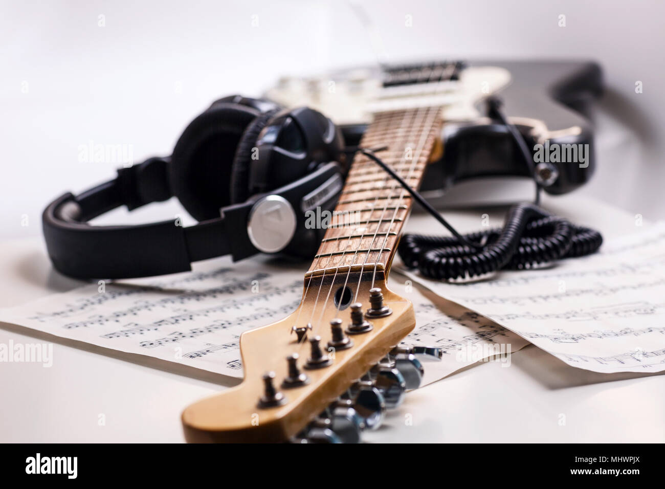Electric guitar and headphones with music notes Stock Photo Alamy