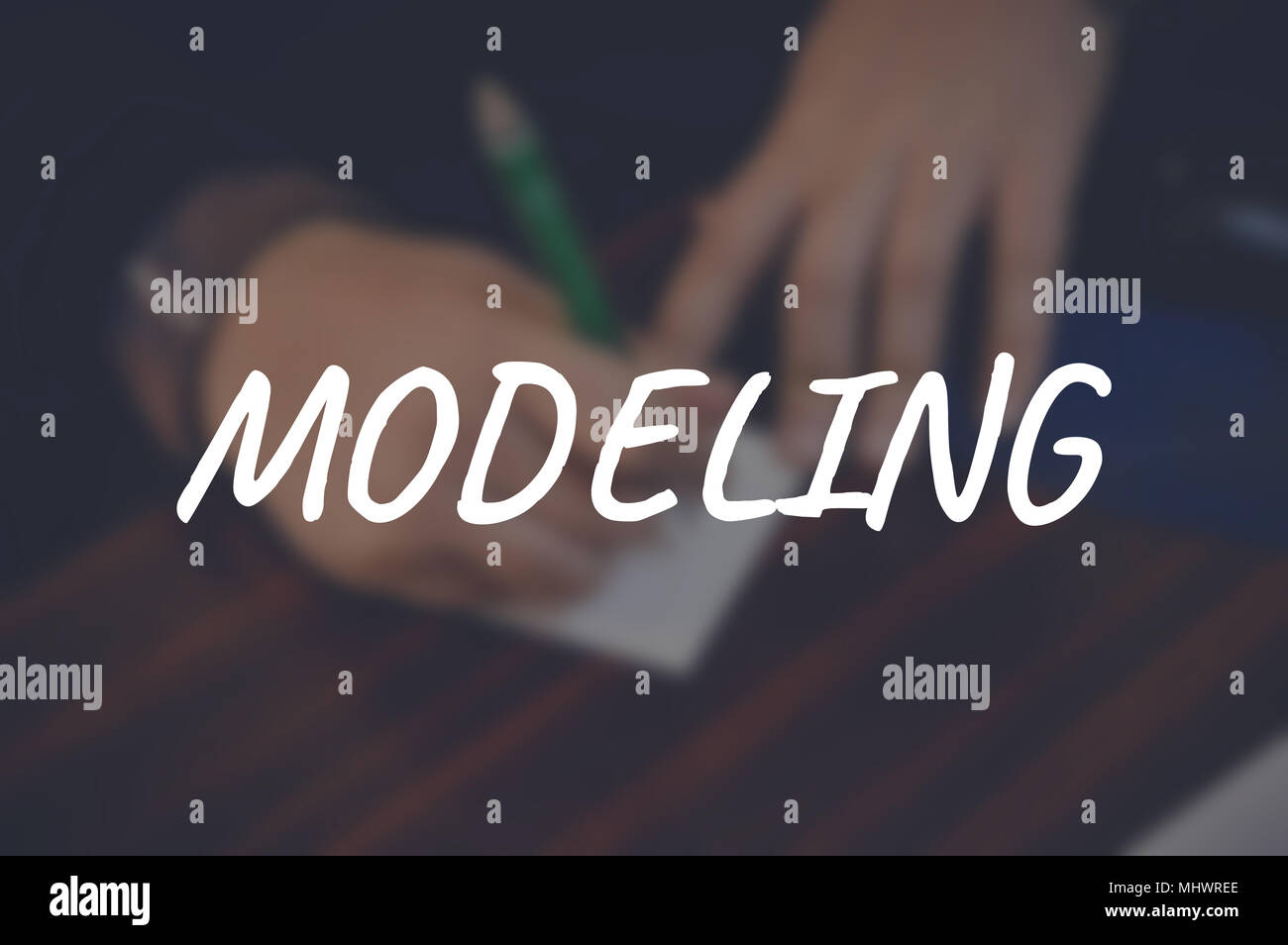 Modeling word with blurring business background Stock Photo Alamy