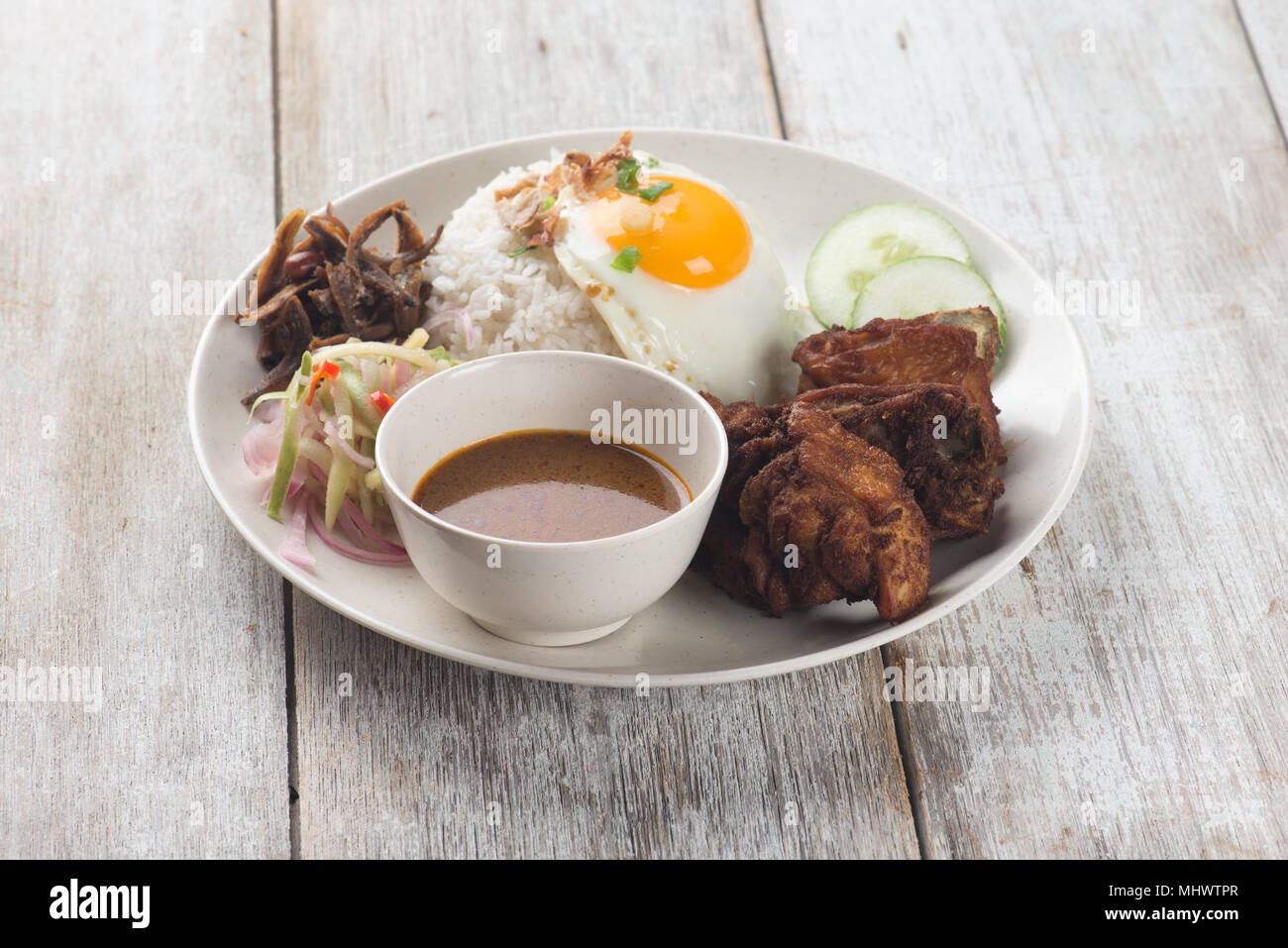 malaysian fried chicken rice with anchovies and egg Stock Photo Alamy