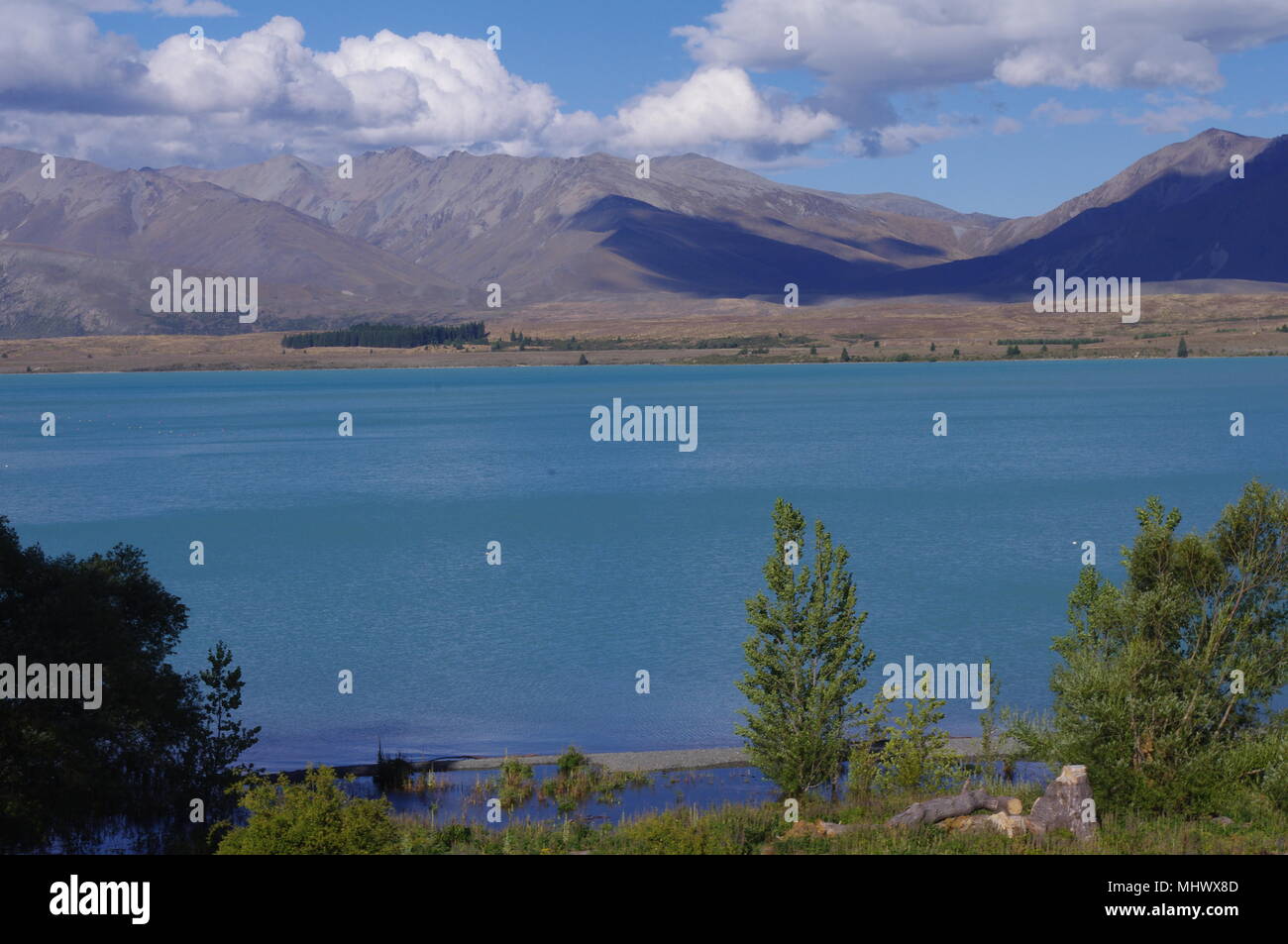 New Zealand Lake Tekapo sunshine landscape Stock Photo - Alamy