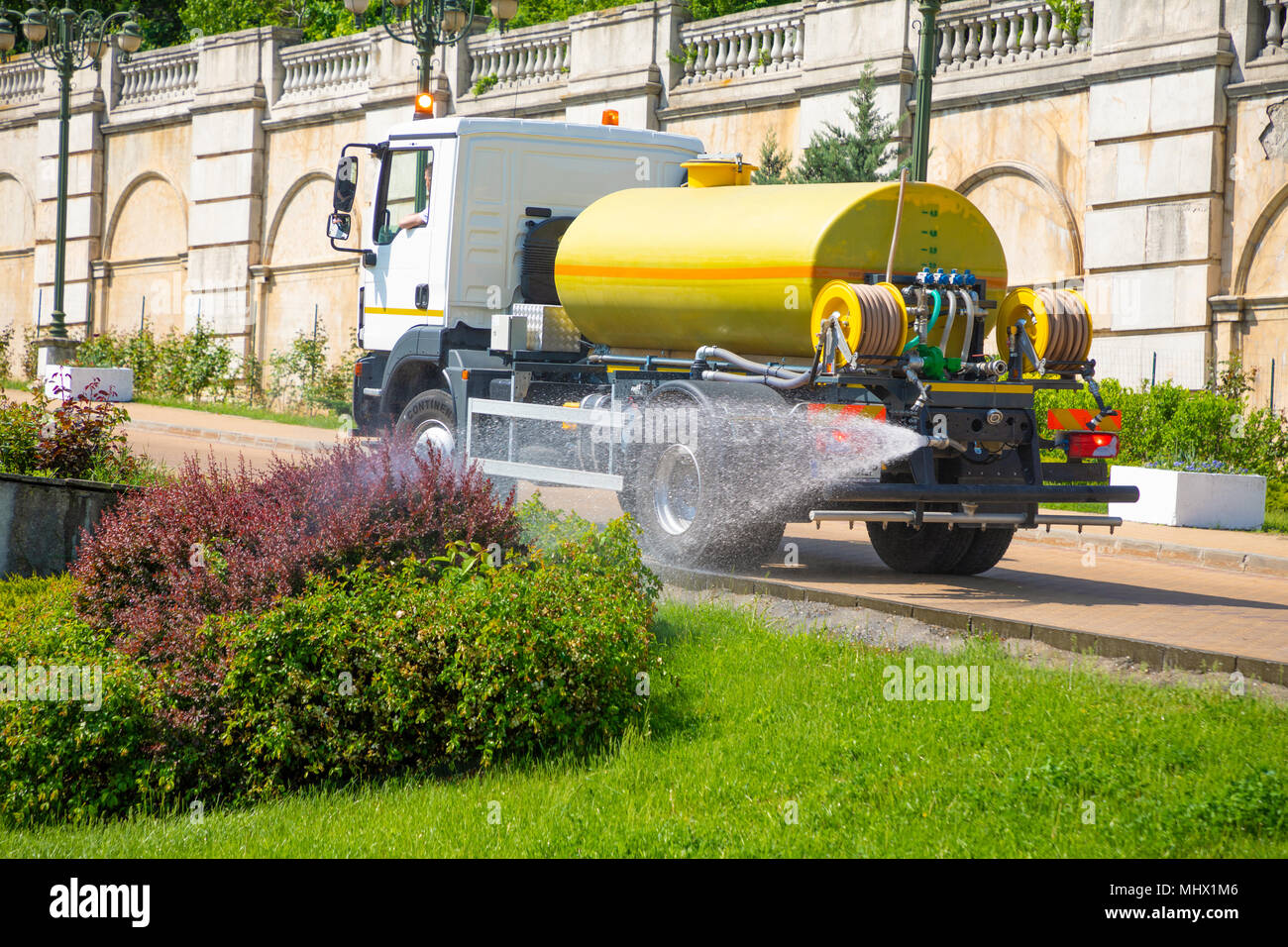 Water sprinkler truck hi-res stock photography and images - Alamy