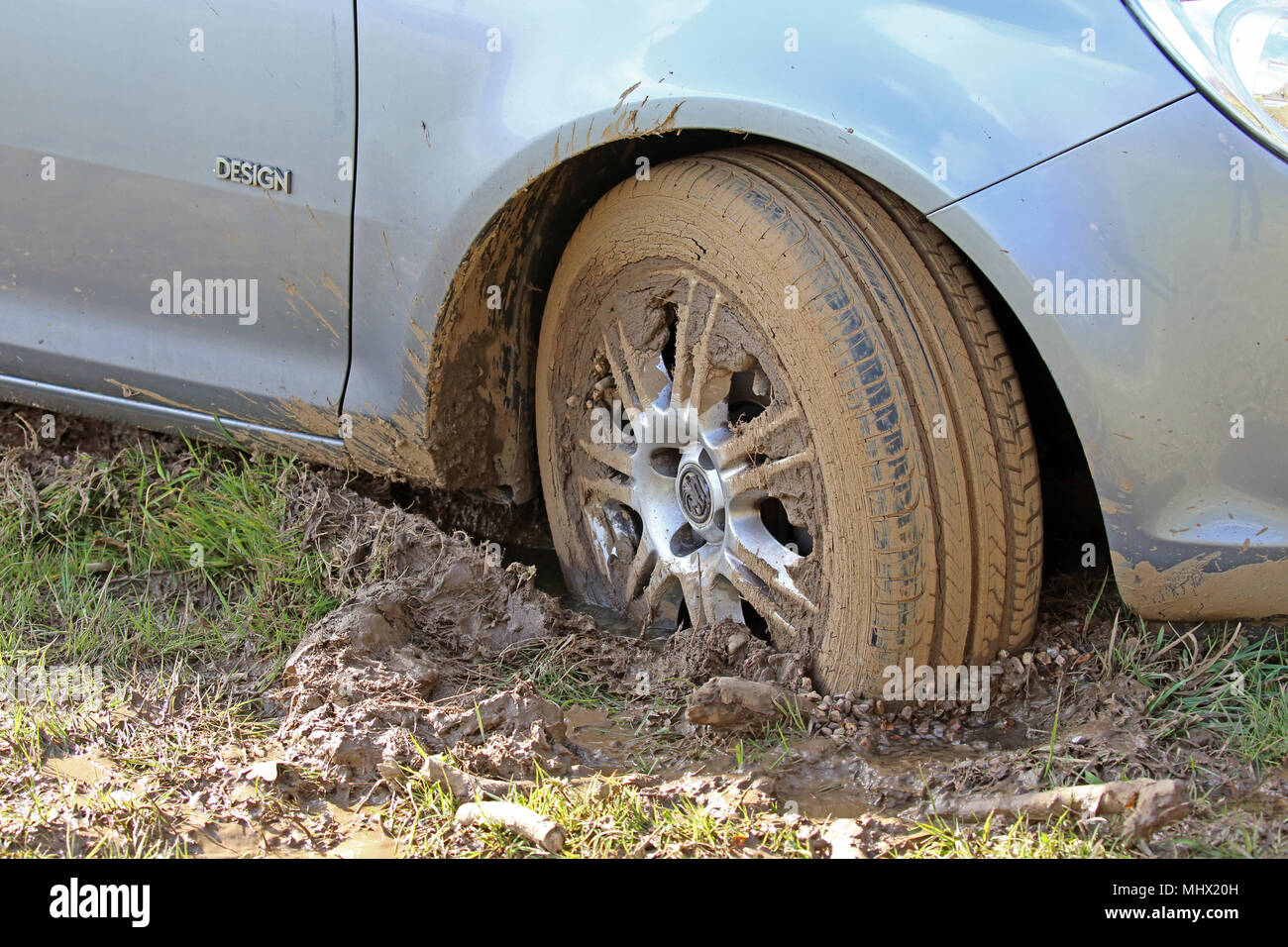 Closeup of the wheel of a Vauxhall Corsa stuck in the mud Stock Photo