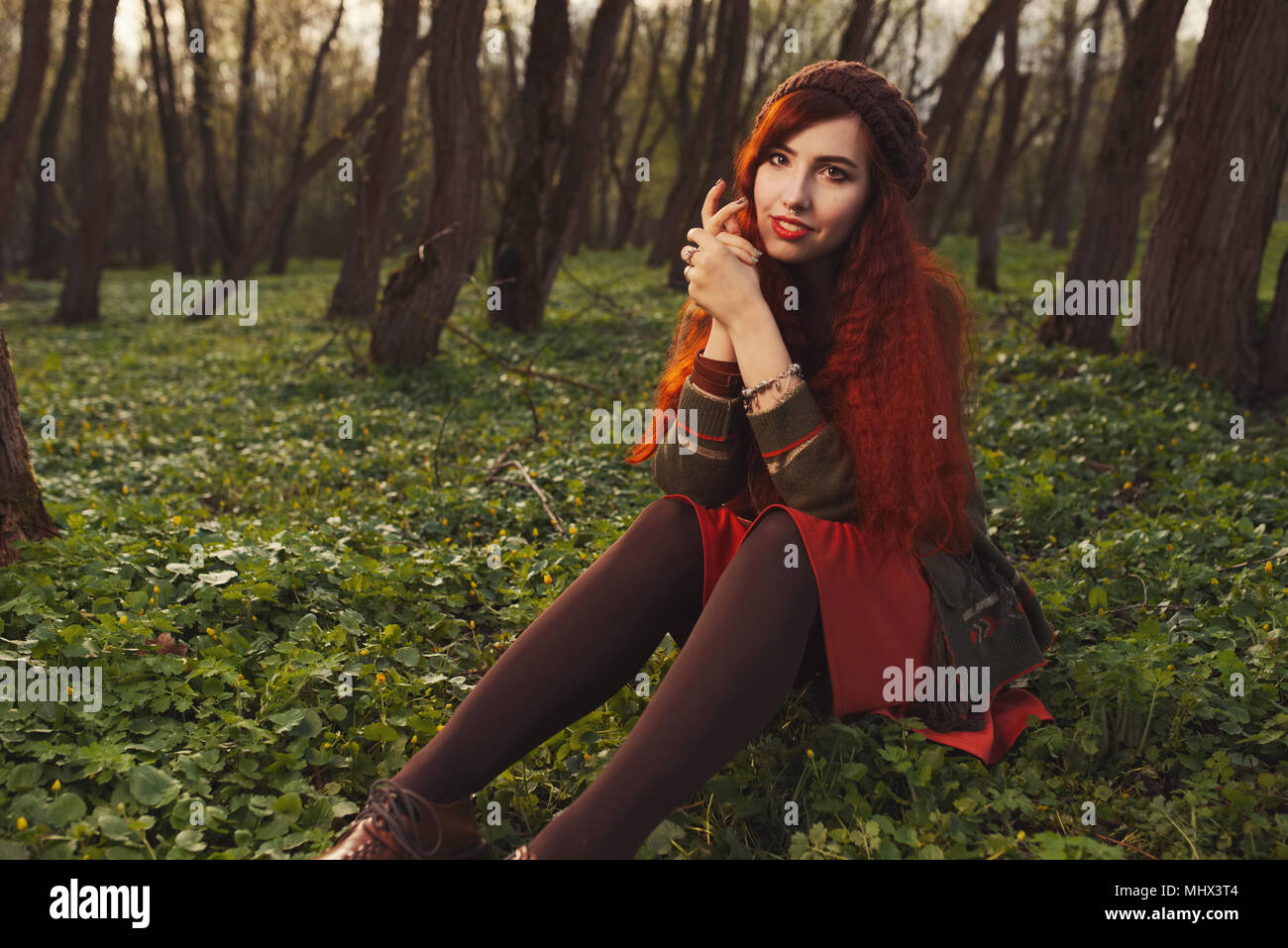 red haired girl in the forest Stock Photo - Alamy