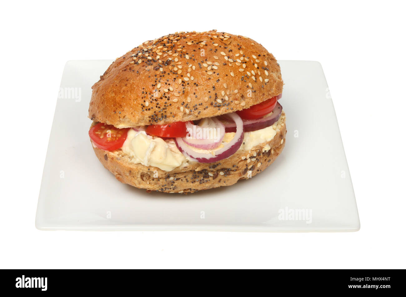 Brie, tomato and red onion roll on a plate isolated against white Stock Photo