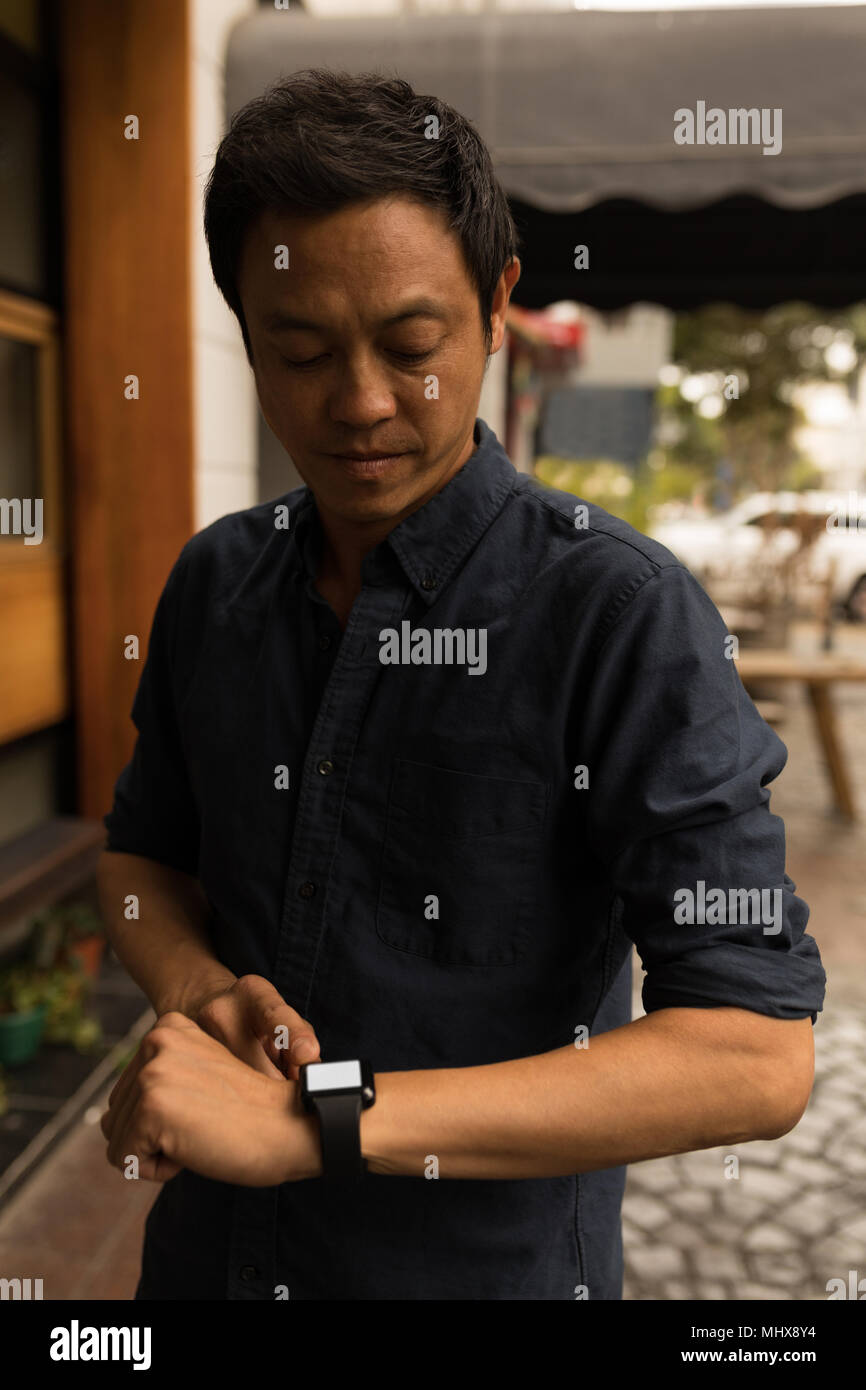 Businessman using smartwatch Stock Photo