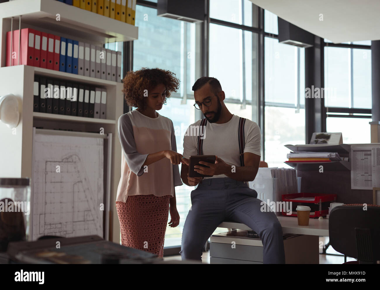 Architects discussing over digital tablet Stock Photo