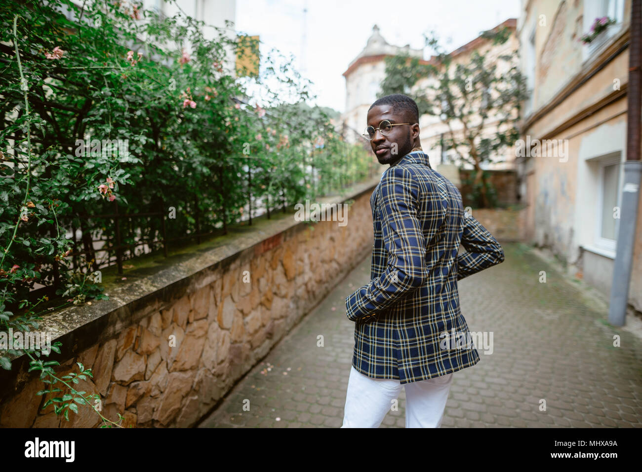 Fashion portrait of black african american man on jacket and coat cloak ...