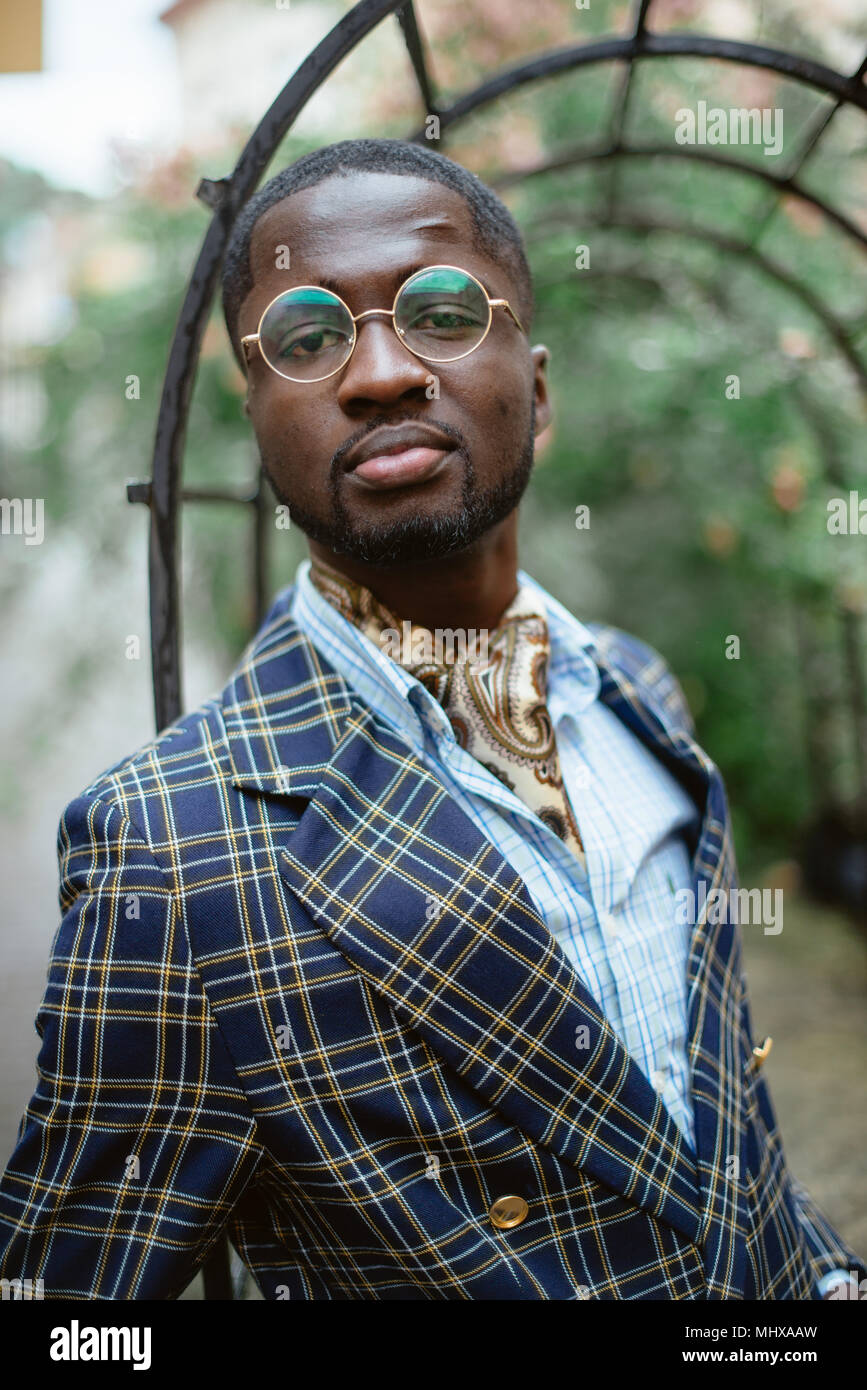 Fashion portrait of black african american man on jacket and coat cloak ...