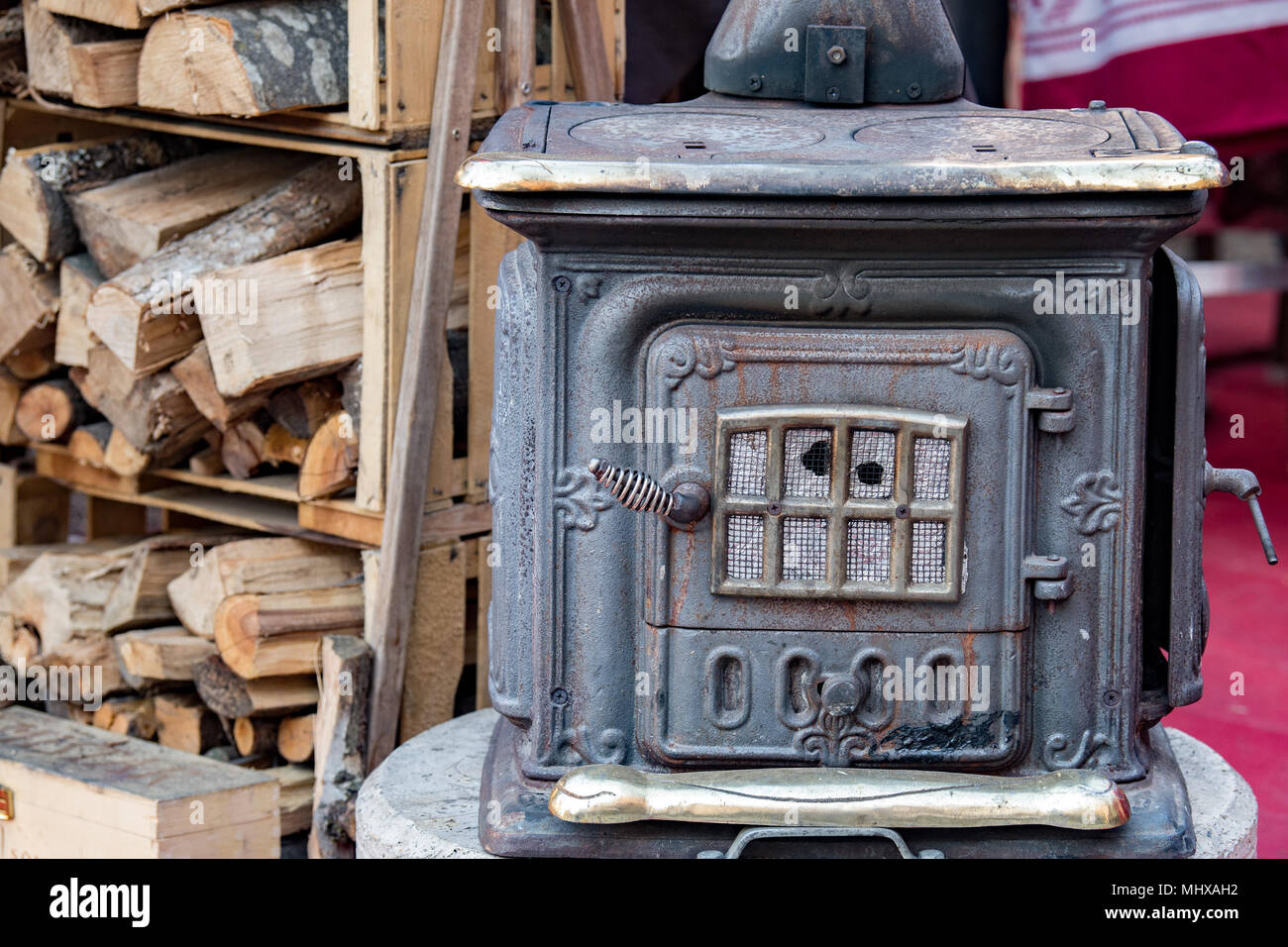 A closeup shot of pieces of wood burning inside old metal oven Stock Photo  - Alamy