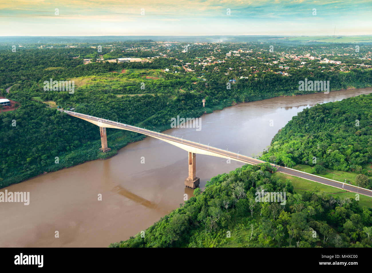 Aerial view of The Tancredo Neves Bridge, better known as Fraternity Bridge connecting Brazil and Argentina through the border over the Iguassu River, Stock Photo