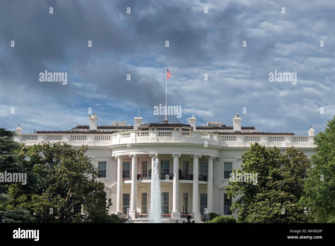 White House Washington DC view on cloudy day background Stock Photo - Alamy