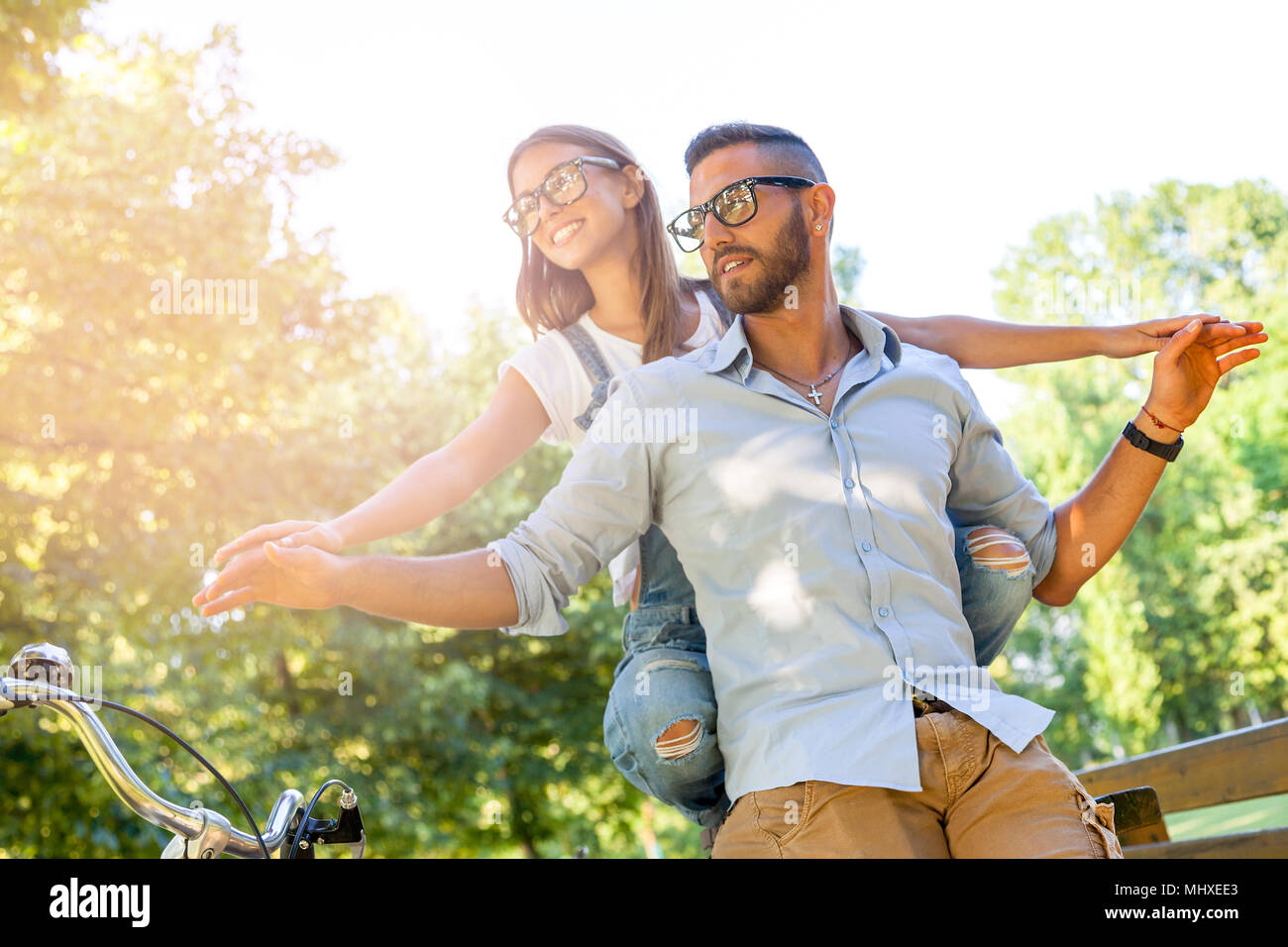 beautiful young couple having fun in the park Stock Photo - Alamy