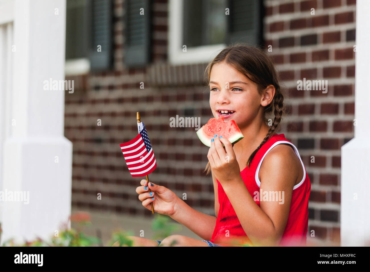 Girl holding american flag hi-res stock photography and images - Alamy