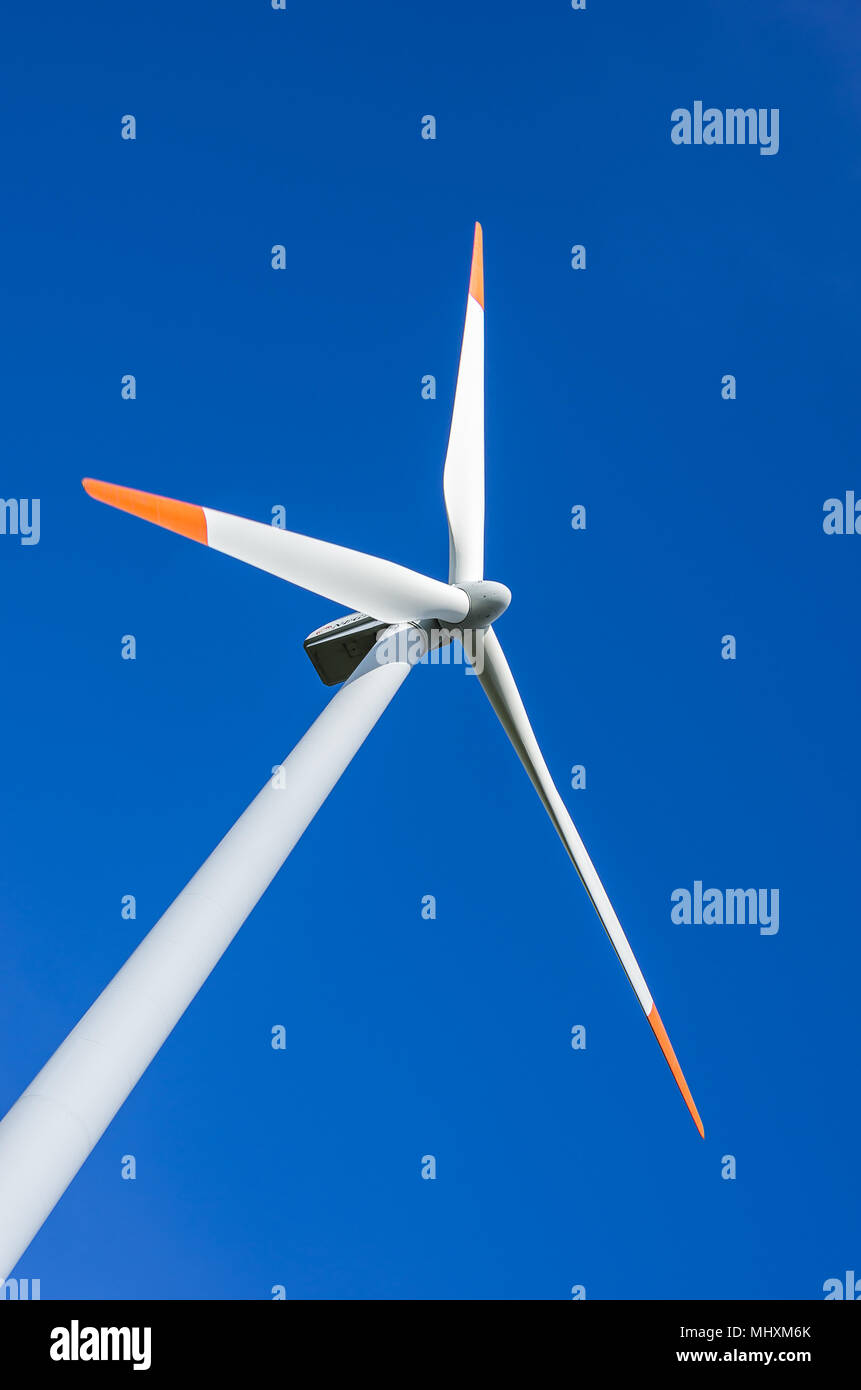 A wind turbine is a wind-powered electrical generator. Stock Photo